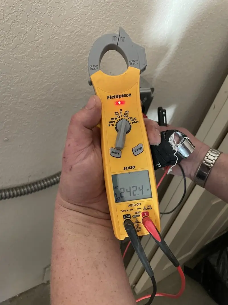 Voltage testing with clamp meter during Outlet Installation in Sheffield